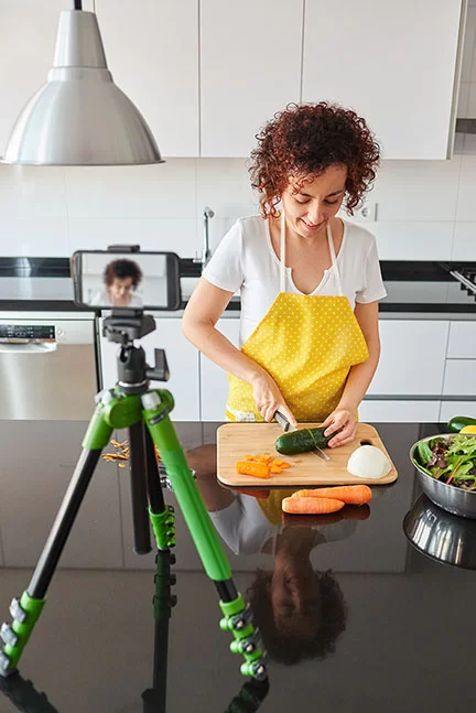 Young blogger and online influencer recording video content on h